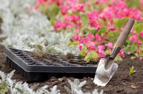 Professional landscapers working on a residential garden in Aldgate